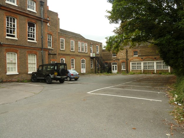 The front driveway of Chestnuts House, showing the northern range and stables block, July 2013