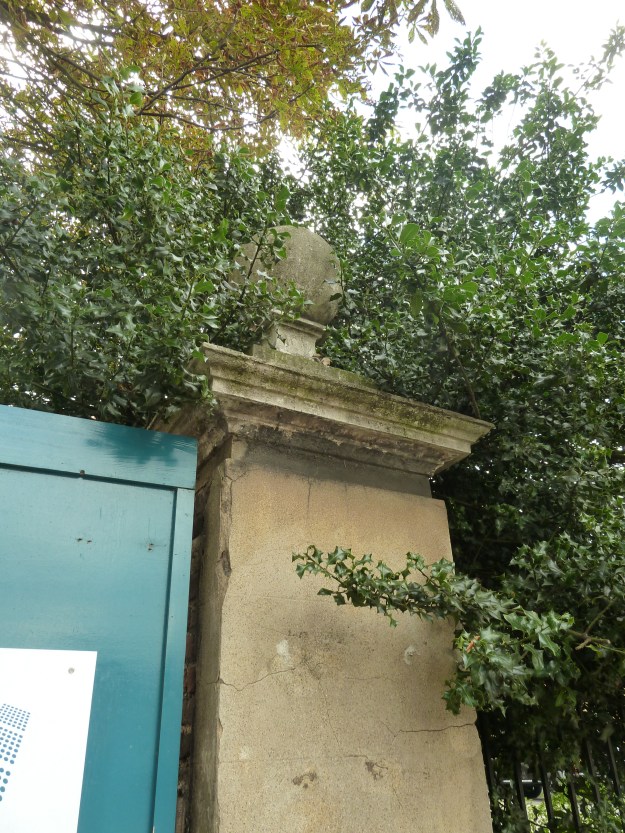 One of the ball topped gateposts fronting Hoe Street. Along with the rest of the building, these gateposts are listed at Grade 2*